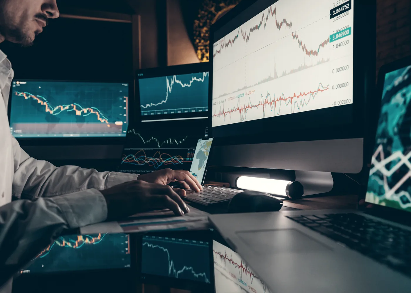 Analysts working at a trading and market data desk